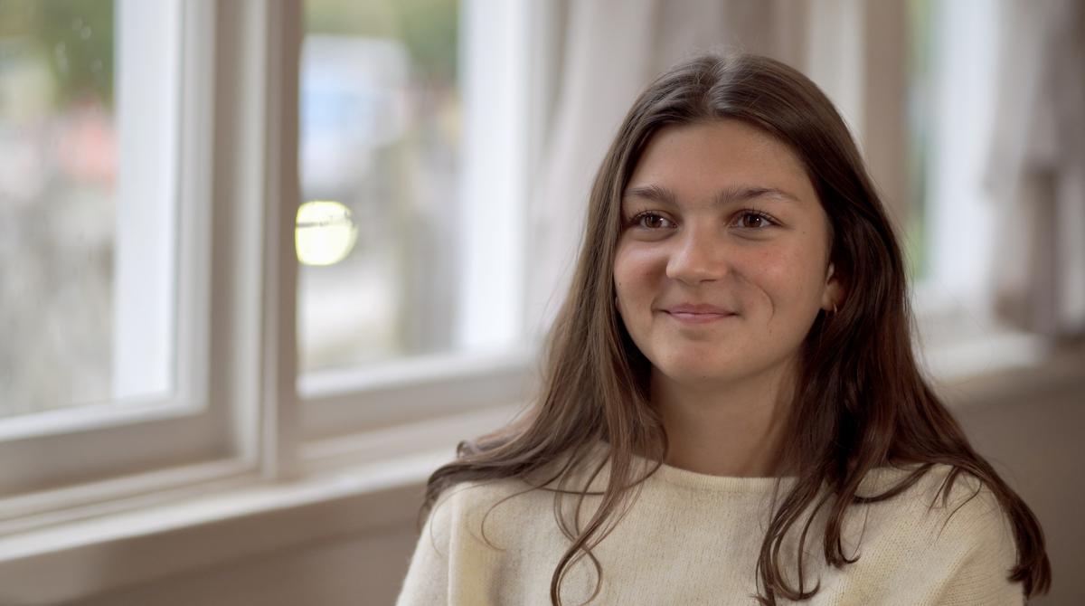 Teen operating camera on set